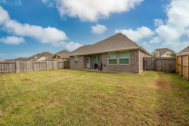 214 San Bernard Dr, Baytown, TX 77523 - rear view of house with brick siding and roof with shingles