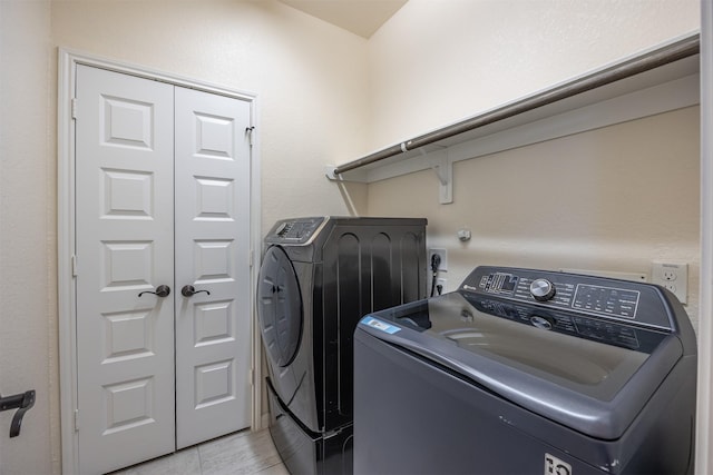 214 San Bernard Dr, Baytown, TX 77523 - clothes washing area with washing machine and clothes dryer