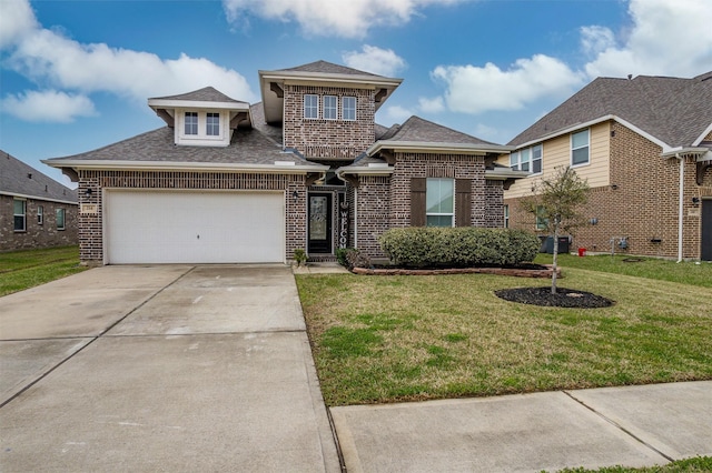 214 San Bernard Dr, Baytown, TX 77523 - view of front facade featuring brick siding, roof with shingles, a front yard, and concrete driveway