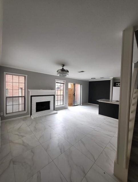 2211 S Kirkwood Rd Unit 69, Houston, TX 77077 - unfurnished living room with light marble finish floors, a brick fireplace, and baseboards