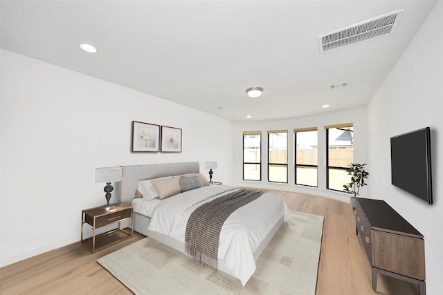 bedroom featuring light wood-style floors and recessed lighting