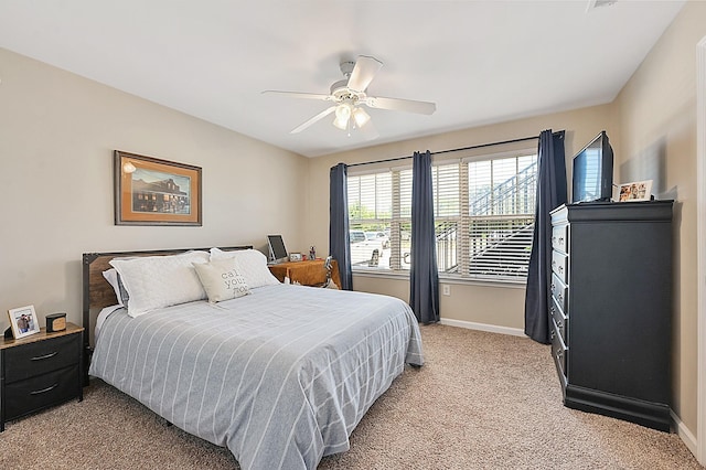 1725 Harvey Mitchell Pkwy S Unit 211, College Station, TX 77840 - bedroom featuring light colored carpet, baseboards, and a ceiling fan