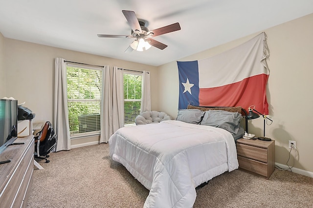 1725 Harvey Mitchell Pkwy S Unit 211, College Station, TX 77840 - bedroom with carpet floors, baseboards, and a ceiling fan