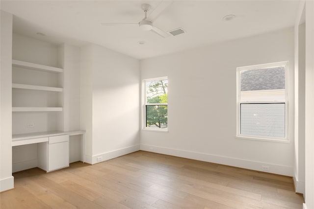 966 Lamonte Ln, Houston, TX 77018 - unfurnished bedroom with light wood finished floors, baseboards, and a ceiling fan