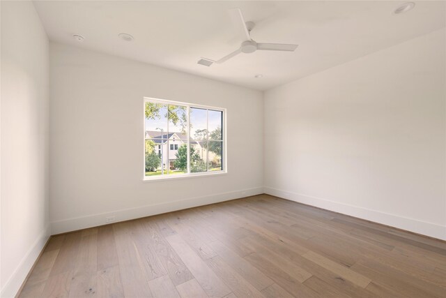 966 Lamonte Ln, Houston, TX 77018 - empty room with baseboards, light wood finished floors, and ceiling fan