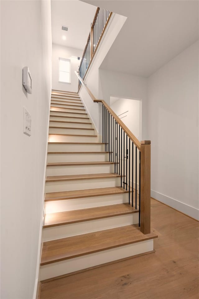 966 Lamonte Ln, Houston, TX 77018 - stairs with baseboards and wood finished floors