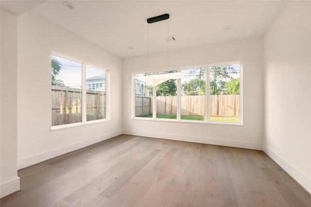 966 Lamonte Ln, Houston, TX 77018 - unfurnished dining area with baseboards and light wood-type flooring