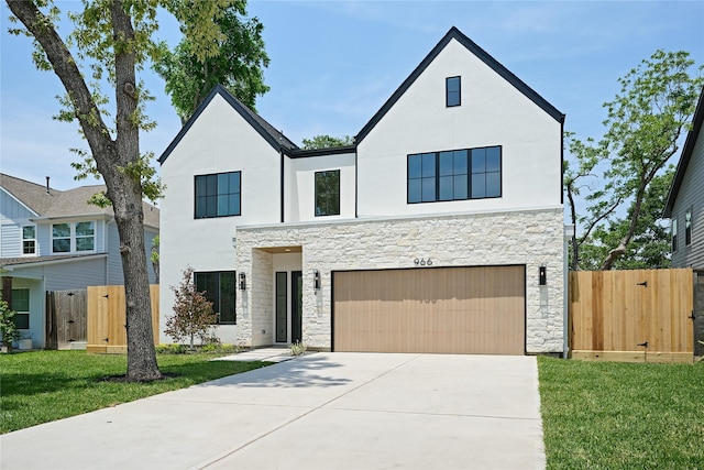 966 Lamonte Ln, Houston, TX 77018 - view of front of house featuring stone siding, an attached garage, a gate, and concrete driveway