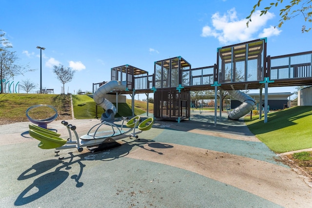 community playground featuring a lawn