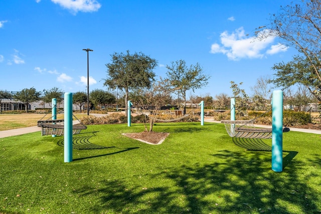 view of property's community featuring a yard