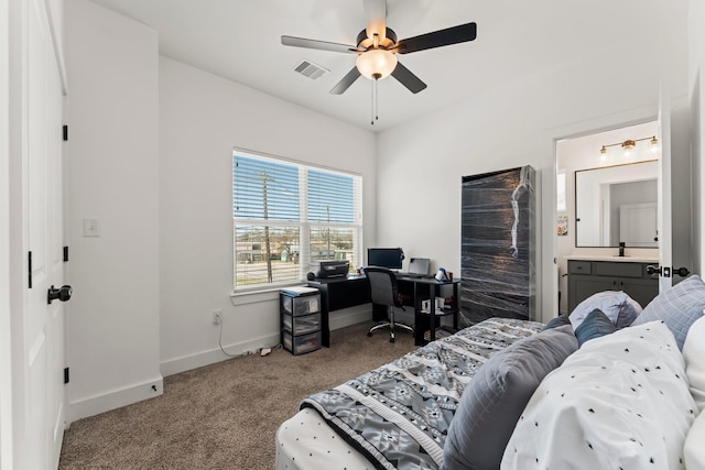 carpeted bedroom featuring baseboards, an office area, and ceiling fan