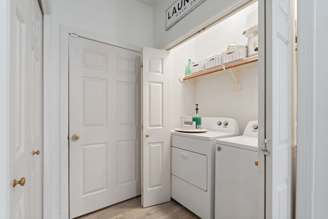 2838 Sunburst Ln, Montgomery, TX 77356 - laundry room featuring independent washer and dryer and light wood-type flooring