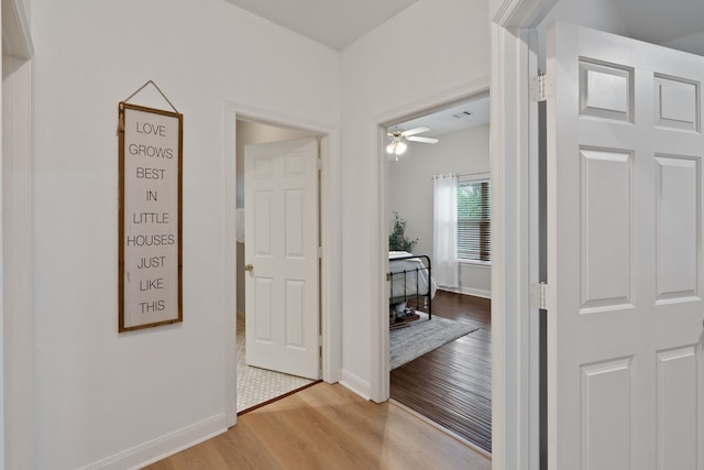 2838 Sunburst Ln, Montgomery, TX 77356 - hallway featuring light wood-style floors and baseboards