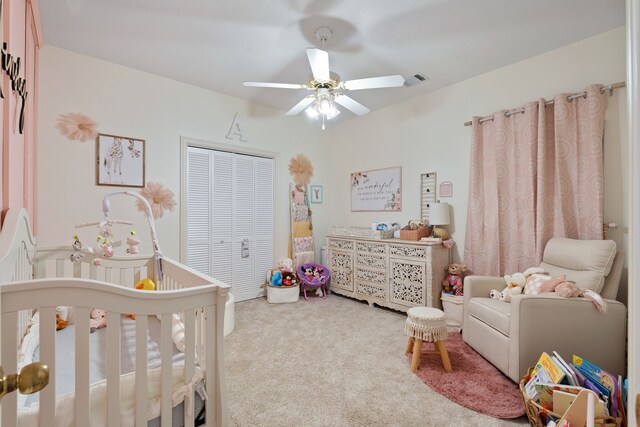 2838 Sunburst Ln, Montgomery, TX 77356 - carpeted bedroom featuring a crib, a closet, and ceiling fan