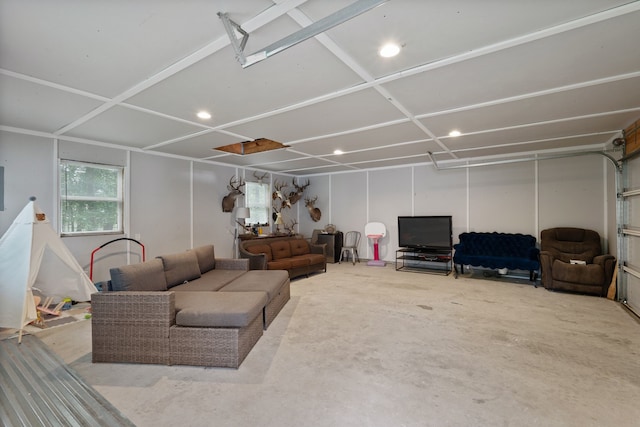 2838 Sunburst Ln, Montgomery, TX 77356 - living area featuring unfinished concrete flooring, a garage, and recessed lighting