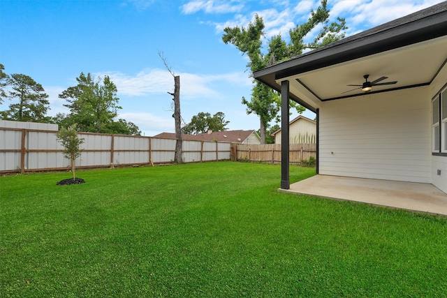 view of yard with a patio and ceiling fan