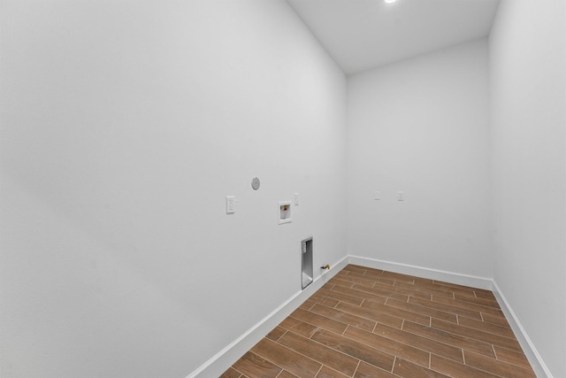 laundry room with hookup for a washing machine, baseboards, gas dryer hookup, dark wood-type flooring, and hookup for an electric dryer