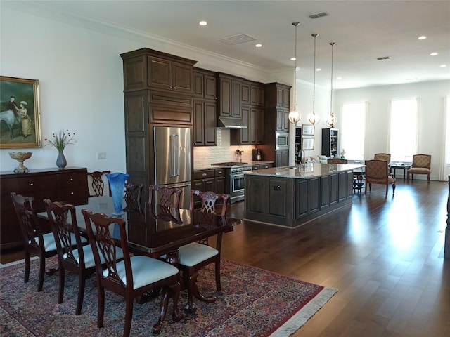 3622 Lannister Ln, Houston, TX 77055 - dining area featuring dark wood-style flooring, recessed lighting, and ornamental molding