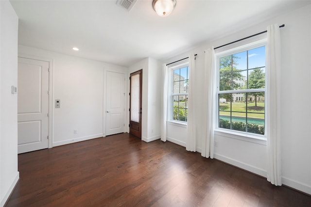 3622 Lannister Ln, Houston, TX 77055 - empty room featuring dark wood-style floors, baseboards, and recessed lighting