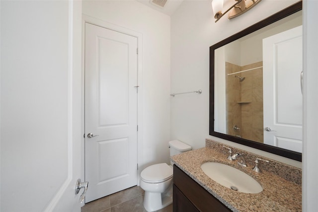3622 Lannister Ln, Houston, TX 77055 - bathroom featuring vanity, toilet, tile patterned flooring, and a shower