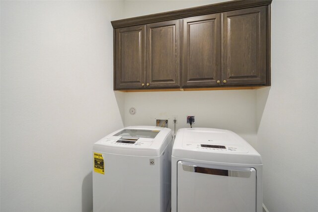 3622 Lannister Ln, Houston, TX 77055 - clothes washing area featuring cabinet space and independent washer and dryer