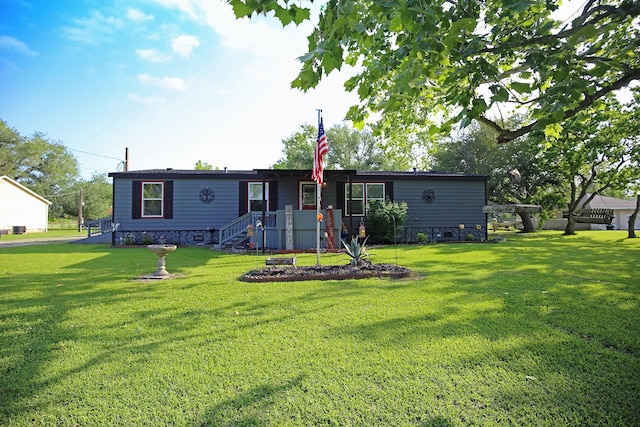 15402 Maple St, Santa Fe, TX 77517 - rear view of property with a lawn