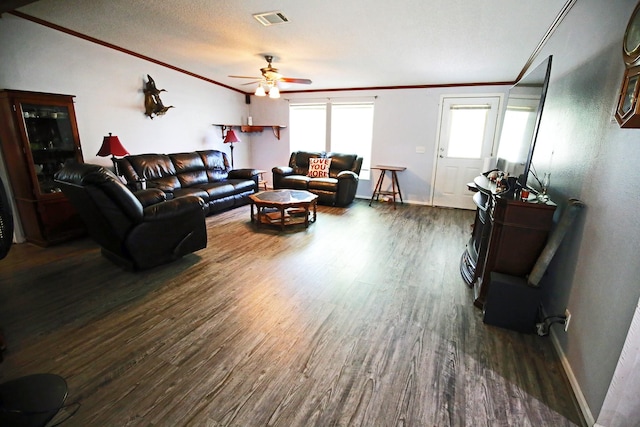 15402 Maple St, Santa Fe, TX 77517 - living area featuring ornamental molding, dark wood finished floors, a ceiling fan, and baseboards
