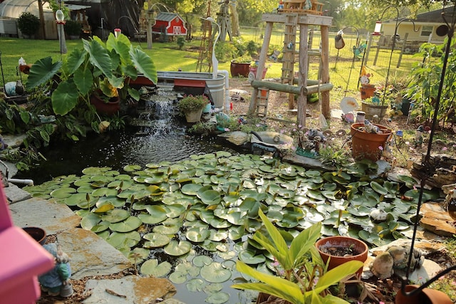 15402 Maple St, Santa Fe, TX 77517 - view of yard with a garden pond