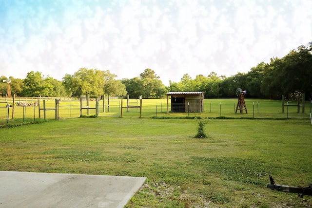 15402 Maple St, Santa Fe, TX 77517 - view of yard with an outbuilding