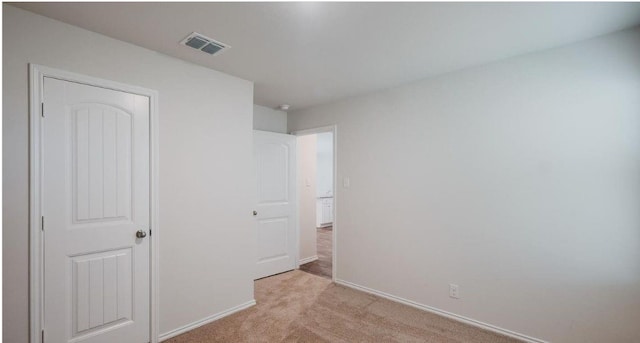 12803 Heddington Grove Ln, Houston, TX 77047 - unfurnished bedroom featuring light colored carpet and baseboards