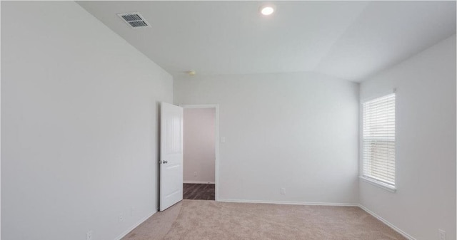12803 Heddington Grove Ln, Houston, TX 77047 - empty room with light colored carpet, baseboards, vaulted ceiling, and recessed lighting
