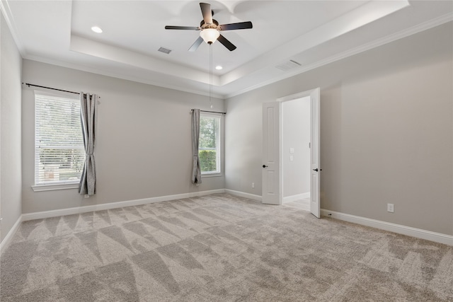 28116 Chuckwagon Trl, Magnolia, TX 77355 - spare room with a raised ceiling, light colored carpet, recessed lighting, a ceiling fan, and baseboards