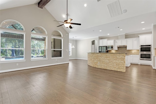 28116 Chuckwagon Trl, Magnolia, TX 77355 - living room featuring ceiling fan, beamed ceiling, wood finished floors, recessed lighting, and baseboards