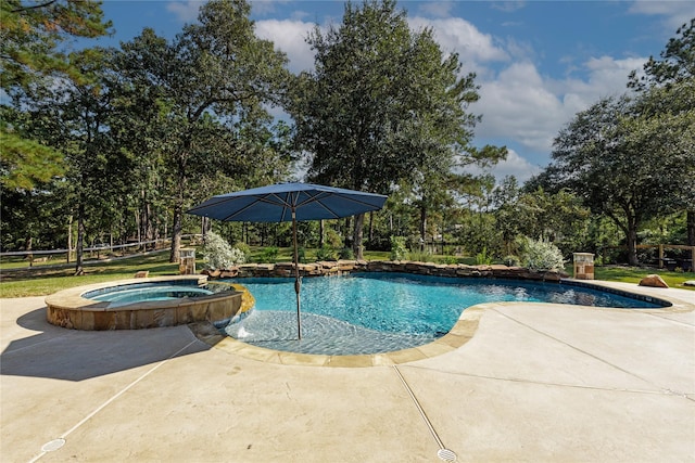 28116 Chuckwagon Trl, Magnolia, TX 77355 - view of pool featuring a patio area, a pool with connected hot tub, and view of scattered trees