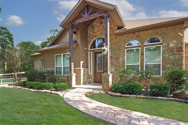 28116 Chuckwagon Trl, Magnolia, TX 77355 - property entrance with stone siding and a lawn