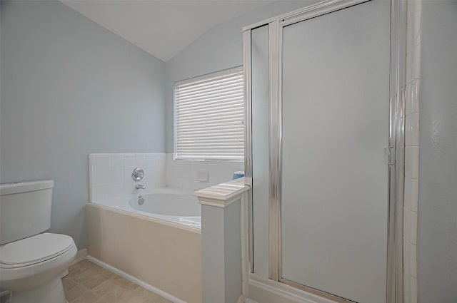 full bath with lofted ceiling, a stall shower, toilet, a garden tub, and tile patterned floors