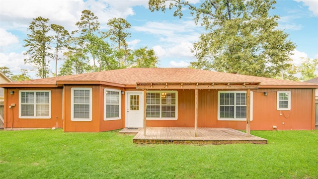 9024 Zapata Way, Willis, TX 77378 - rear view of house featuring a shingled roof, a wooden deck, and a yard