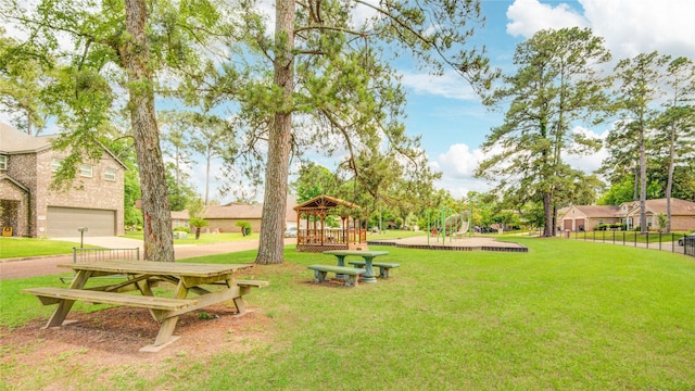 9024 Zapata Way, Willis, TX 77378 - view of home's community featuring a gazebo, a lawn, and a garage