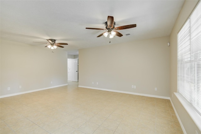 9024 Zapata Way, Willis, TX 77378 - spare room featuring a ceiling fan and baseboards