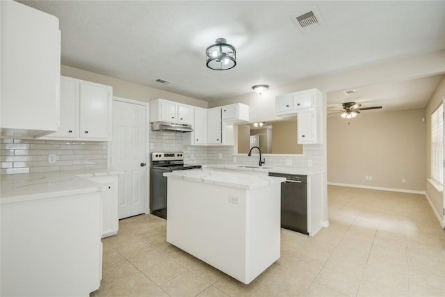 9024 Zapata Way, Willis, TX 77378 - kitchen with black dishwasher, under cabinet range hood, a sink, stainless steel electric range oven, and tasteful backsplash