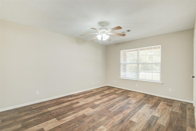 9024 Zapata Way, Willis, TX 77378 - spare room featuring wood finished floors, ceiling fan, and baseboards