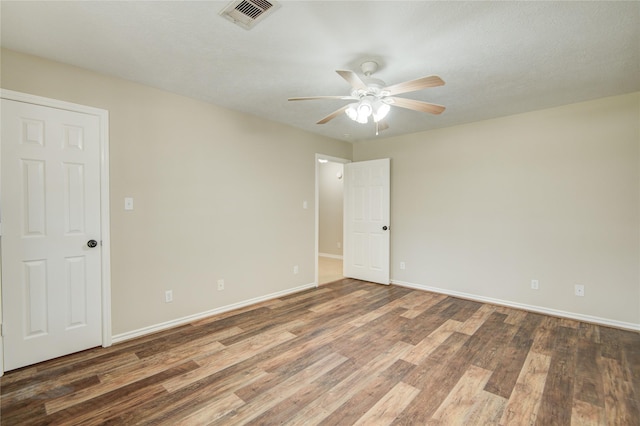 9024 Zapata Way, Willis, TX 77378 - empty room featuring ceiling fan, wood finished floors, and baseboards