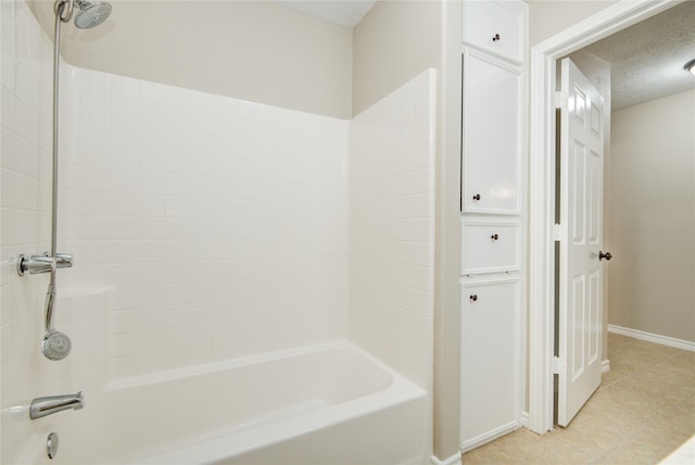 9024 Zapata Way, Willis, TX 77378 - bathroom featuring baseboards, a textured ceiling, shower / bath combination, and tile patterned flooring