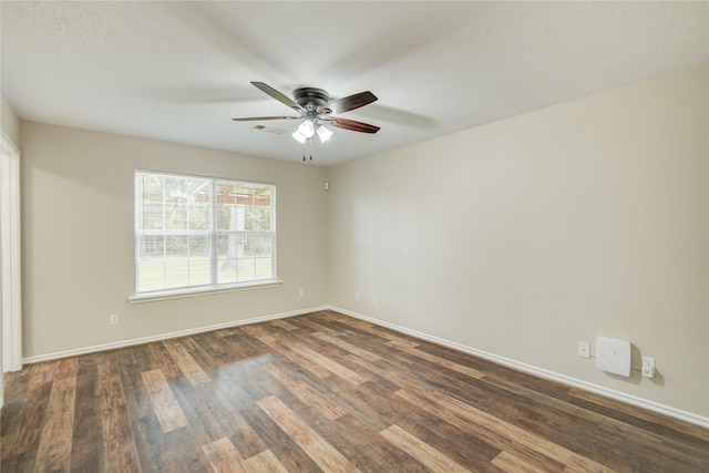 9024 Zapata Way, Willis, TX 77378 - spare room with ceiling fan, dark wood-type flooring, and baseboards