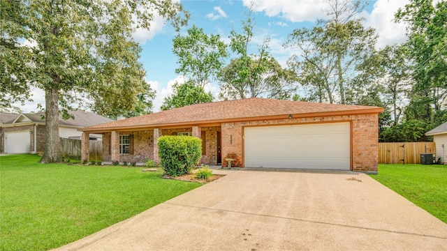 9024 Zapata Way, Willis, TX 77378 - single story home featuring brick siding, a garage, driveway, and central AC