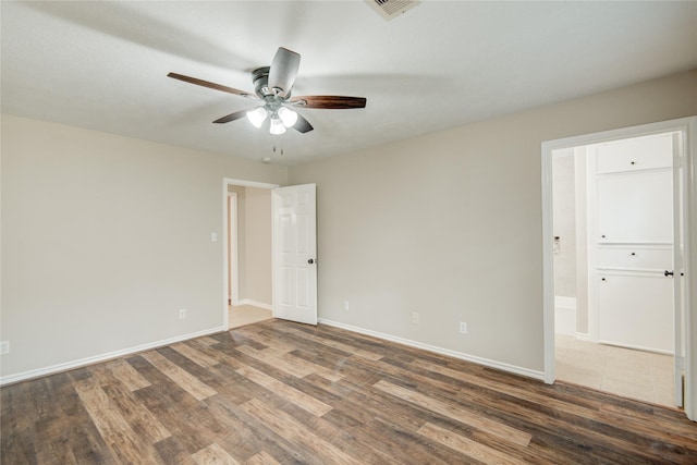 9024 Zapata Way, Willis, TX 77378 - spare room with a ceiling fan, wood finished floors, and baseboards