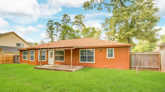 9024 Zapata Way, Willis, TX 77378 - rear view of property featuring a deck