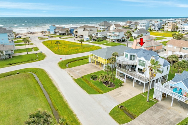 aerial perspective of suburban area with a nearby body of water
