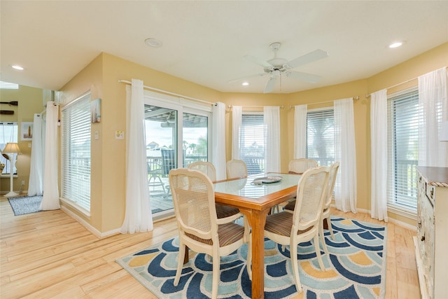 dining area with light wood-type flooring, a ceiling fan, baseboards, and recessed lighting