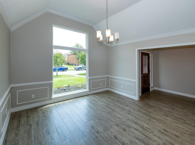 2414 Shoal Creek Dr, League City, TX 77573 - spare room with a chandelier, lofted ceiling, wood finished floors, ornamental molding, and a decorative wall